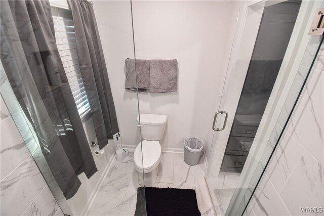 3207 33rd St, Northport, AL 35476 - bathroom featuring a stall shower, toilet, marble finish floor, and baseboards
