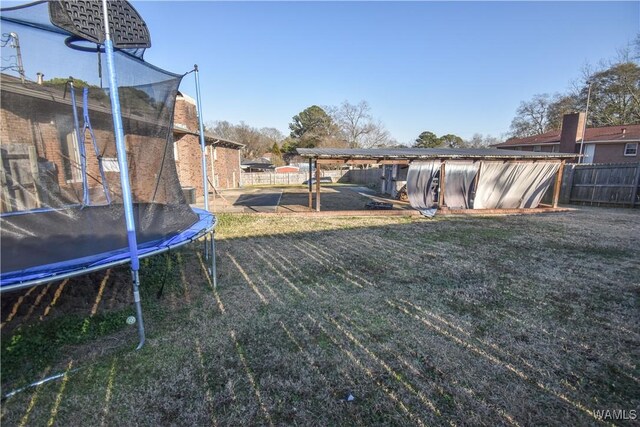 3207 33rd St, Northport, AL 35476 - view of yard with fence and a trampoline