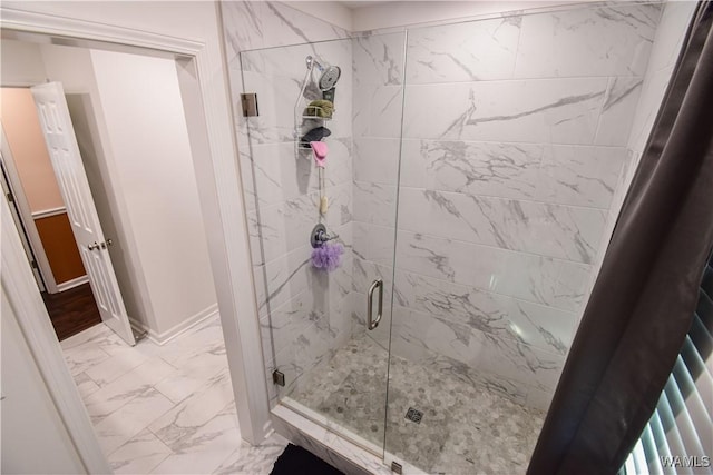 3207 33rd St, Northport, AL 35476 - bathroom with a stall shower, marble finish floor, and baseboards