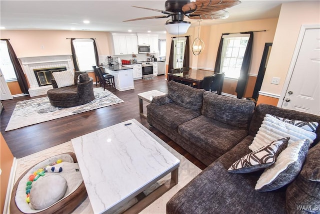 3207 33rd St, Northport, AL 35476 - living area featuring recessed lighting, ceiling fan, dark wood-style flooring, and a fireplace