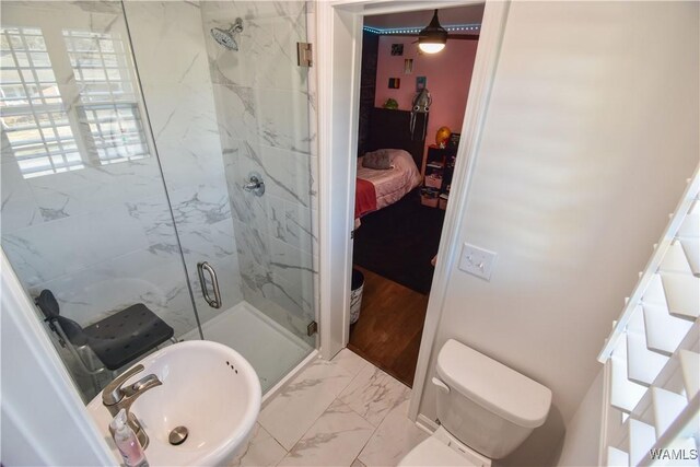 3207 33rd St, Northport, AL 35476 - full bath with a sink, connected bathroom, toilet, a marble finish shower, and marble finish floor