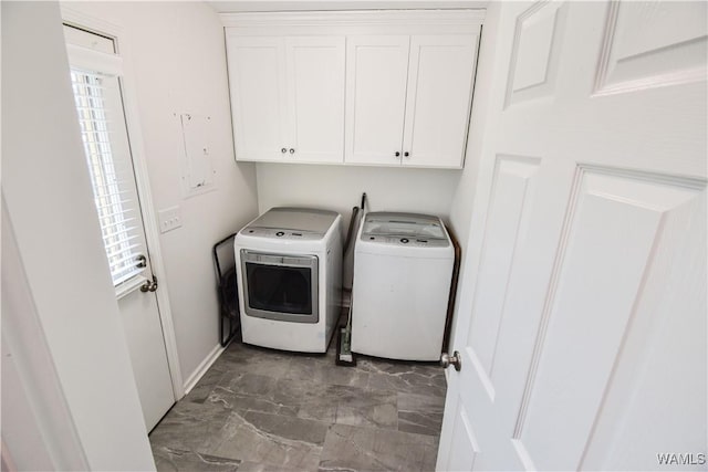 3207 33rd St, Northport, AL 35476 - laundry area featuring marble finish floor, cabinet space, baseboards, and washer and clothes dryer