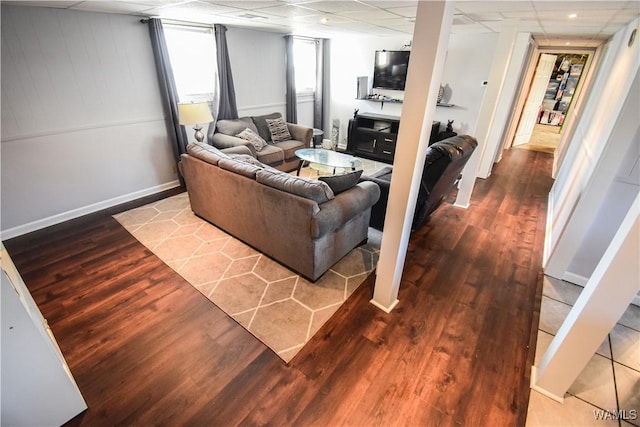 3207 33rd St, Northport, AL 35476 - living area with baseboards, wood finished floors, and a paneled ceiling