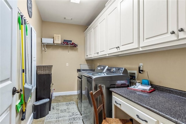 2940 Lake Crest Dr, Tuscaloosa, AL 35406 - laundry room with washing machine and clothes dryer and cabinet space