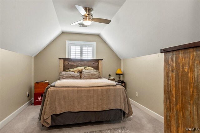 2940 Lake Crest Dr, Tuscaloosa, AL 35406 - bedroom with light carpet, vaulted ceiling, and a ceiling fan