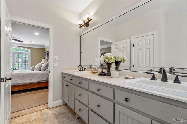 2940 Lake Crest Dr, Tuscaloosa, AL 35406 - ensuite bathroom with double vanity, crown molding, and tile patterned flooring