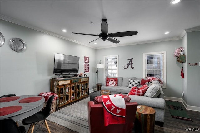 living room with ceiling fan, ornamental molding, and dark wood-type flooring