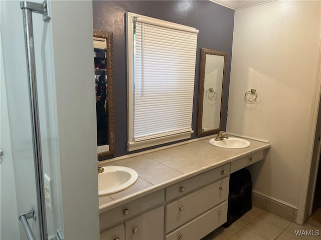 bathroom featuring tile patterned flooring and vanity