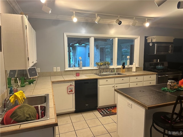 kitchen with sink, white cabinets, black appliances, and ornamental molding