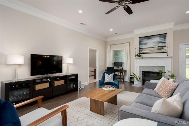 13982 Knoll Pointe Dr, Northport, AL 35475 - living room with wood finished floors, ceiling fan, ornamental molding, recessed lighting, and a high end fireplace