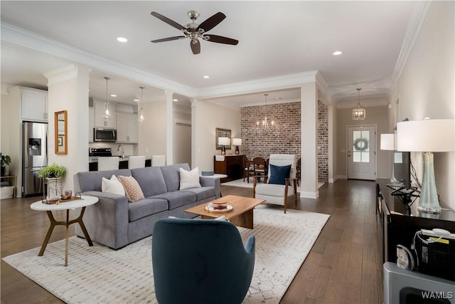 13982 Knoll Pointe Dr, Northport, AL 35475 - living area with ceiling fan, dark wood finished floors, ornamental molding, recessed lighting, and baseboards