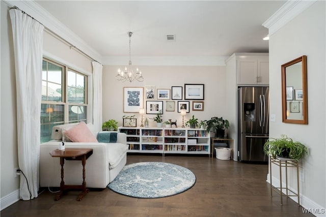 13982 Knoll Pointe Dr, Northport, AL 35475 - sitting room with a chandelier, dark wood-type flooring, ornamental molding, and baseboards