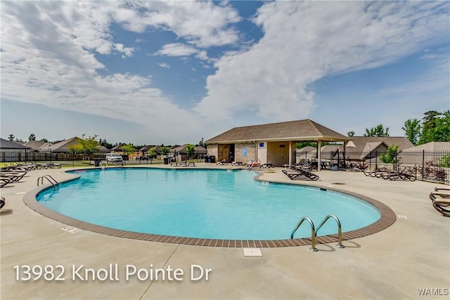 13982 Knoll Pointe Dr, Northport, AL 35475 - community pool featuring a patio