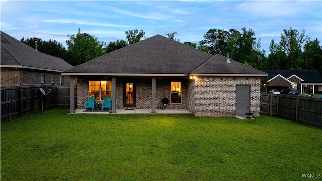 13982 Knoll Pointe Dr, Northport, AL 35475 - back of house with brick siding, a patio, and roof with shingles