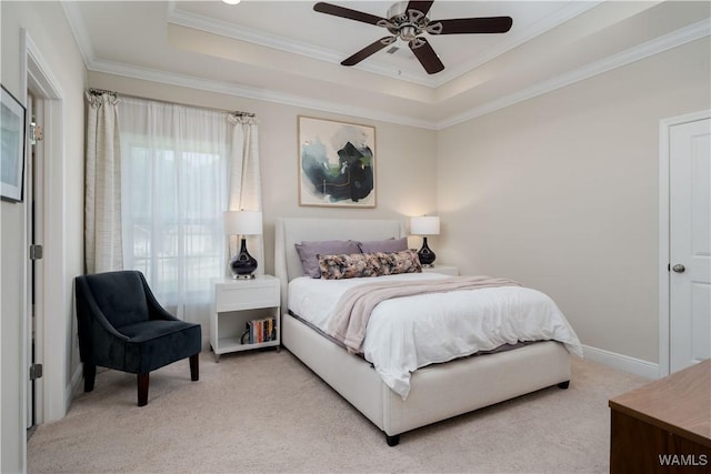 13982 Knoll Pointe Dr, Northport, AL 35475 - bedroom featuring light colored carpet, a tray ceiling, ornamental molding, and a ceiling fan
