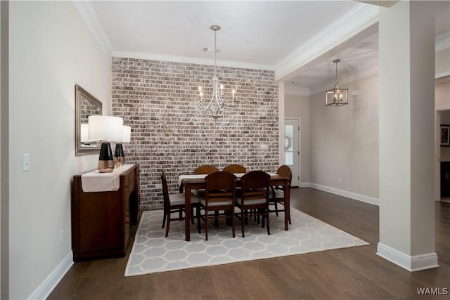 13982 Knoll Pointe Dr, Northport, AL 35475 - dining room with a chandelier, wood finished floors, crown molding, baseboards, and brick wall
