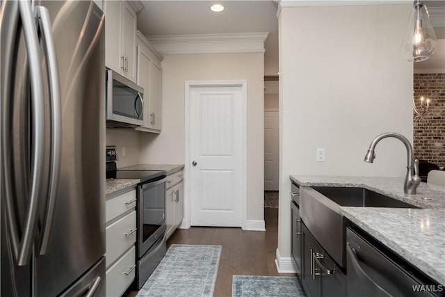 13982 Knoll Pointe Dr, Northport, AL 35475 - kitchen with stainless steel appliances, light stone countertops, dark wood-type flooring, crown molding, and recessed lighting