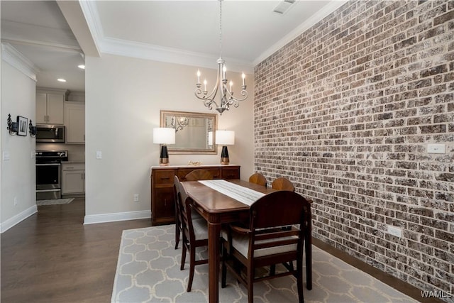 13982 Knoll Pointe Dr, Northport, AL 35475 - dining area featuring ornamental molding, a chandelier, brick wall, baseboards, and dark wood-style floors