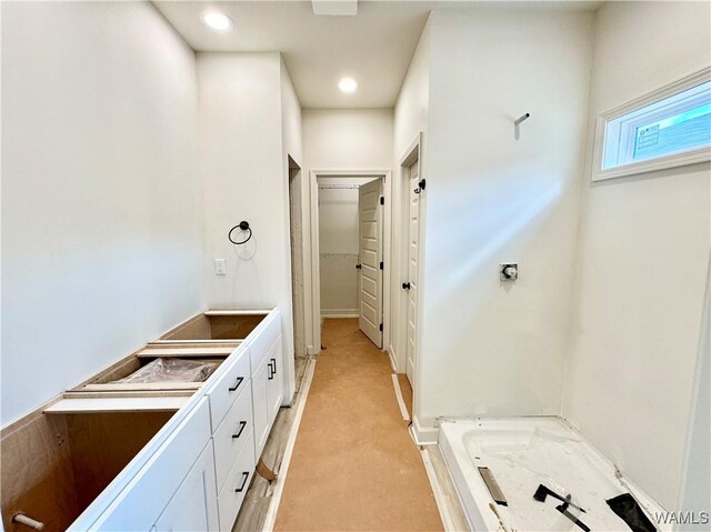 bathroom with vanity, a shower with door, and hardwood / wood-style floors