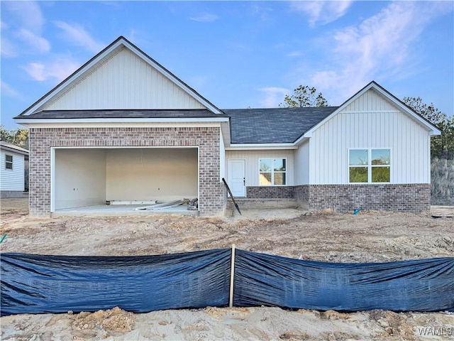 view of front facade featuring an attached garage and brick siding