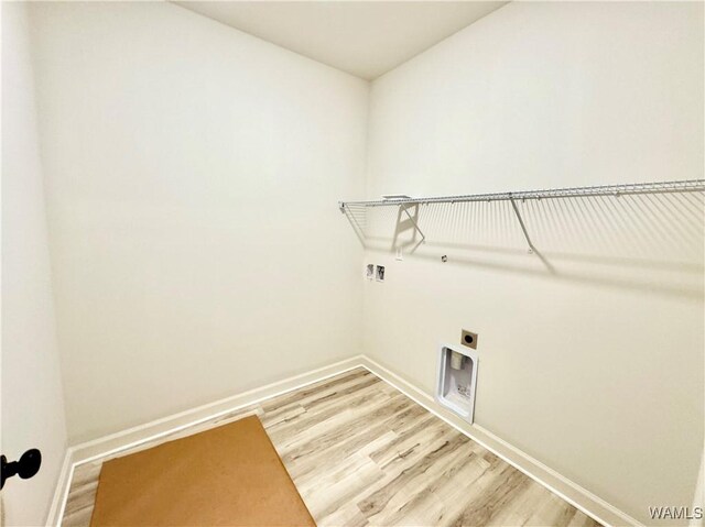 laundry room with wood-type flooring, electric dryer hookup, and washer hookup