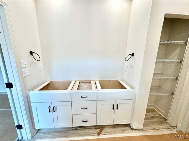 bathroom featuring vanity and hardwood / wood-style flooring