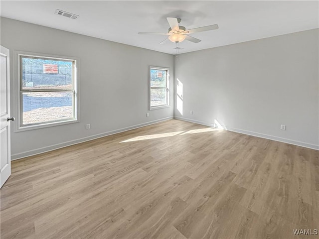 unfurnished room with ceiling fan and light hardwood / wood-style flooring