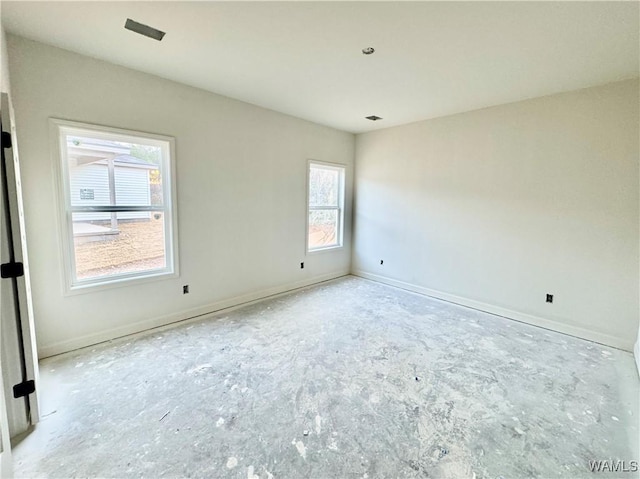 empty room featuring baseboards