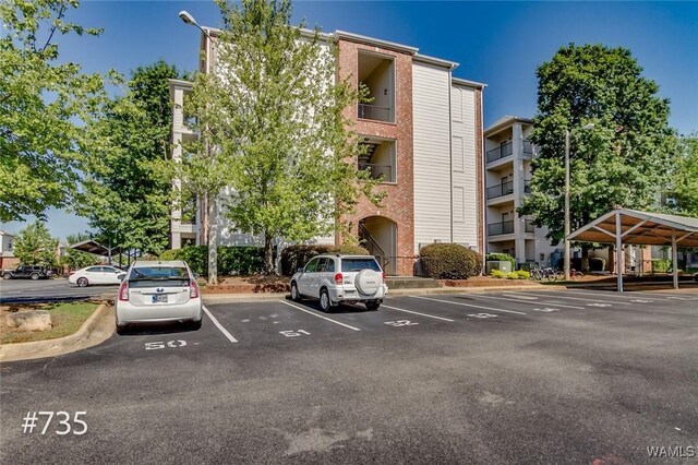 600 13th St E Unit 735, Tuscaloosa, AL 35401 - view of apartment building / complex featuring uncovered parking