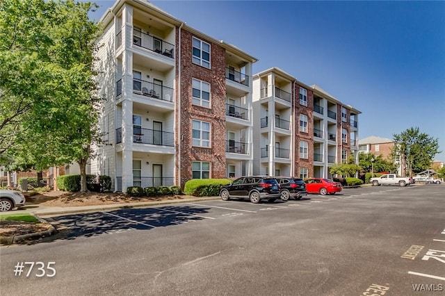 600 13th St E Unit 735, Tuscaloosa, AL 35401 - view of apartment building / complex featuring uncovered parking