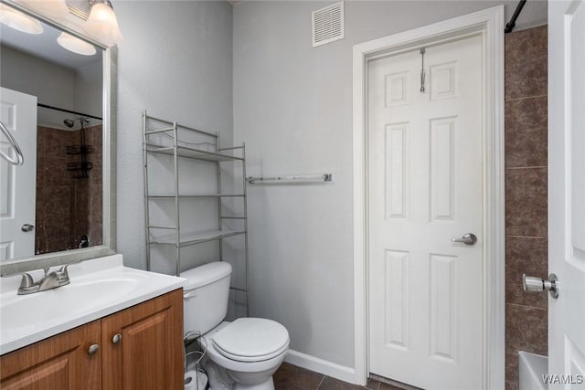 600 13th St E Unit 735, Tuscaloosa, AL 35401 - full bath with vanity, toilet, tile patterned flooring, baseboards, and shower / washtub combination