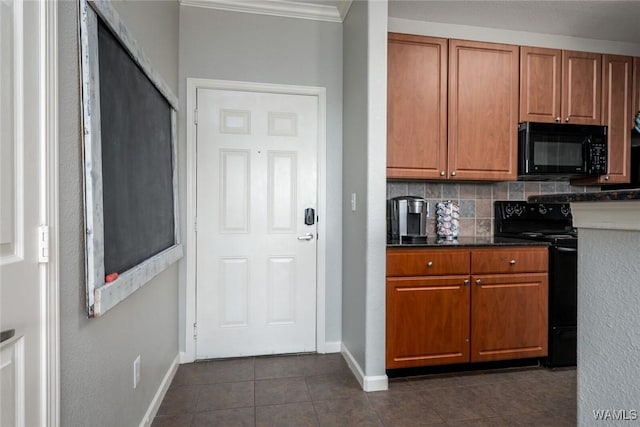 600 13th St E Unit 735, Tuscaloosa, AL 35401 - kitchen with black appliances, baseboards, brown cabinets, dark tile patterned flooring, and crown molding