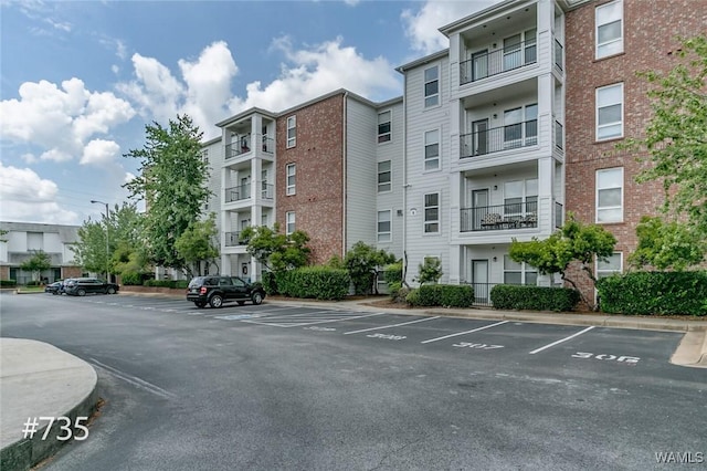 600 13th St E Unit 735, Tuscaloosa, AL 35401 - view of apartment building / complex featuring uncovered parking