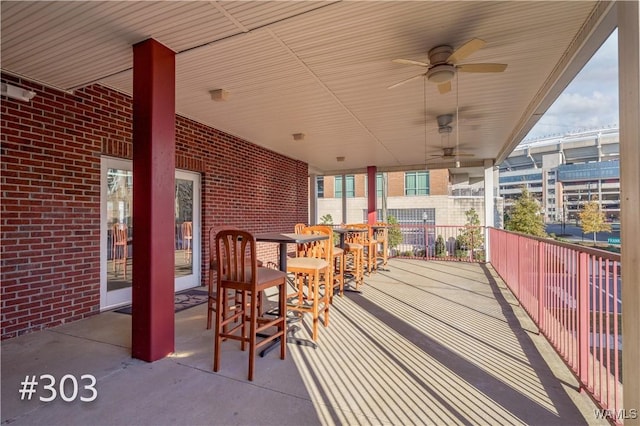 view of patio featuring ceiling fan