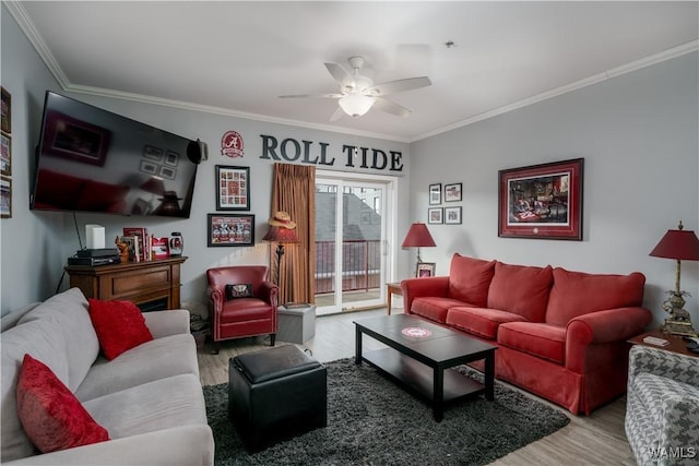 living room with hardwood / wood-style flooring, ceiling fan, and ornamental molding