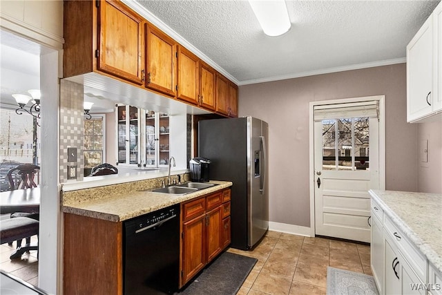 kitchen featuring stainless steel fridge, black dishwasher, light countertops, a textured ceiling, and a sink