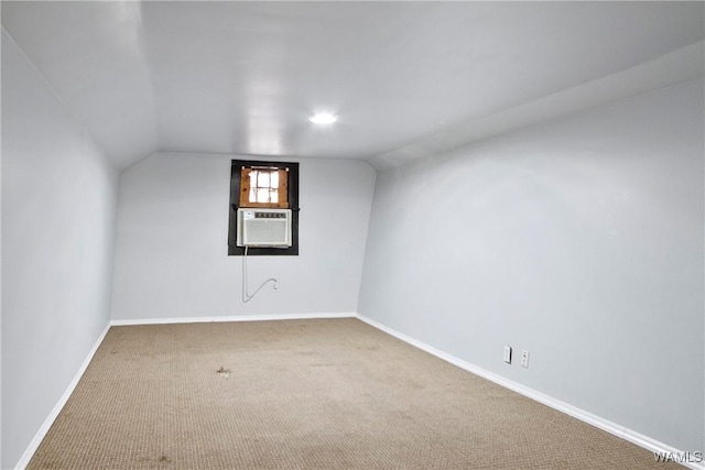 bonus room featuring lofted ceiling, carpet floors, baseboards, and cooling unit