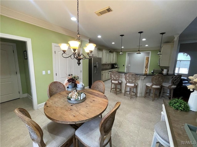 dining space featuring crown molding, recessed lighting, visible vents, a chandelier, and baseboards