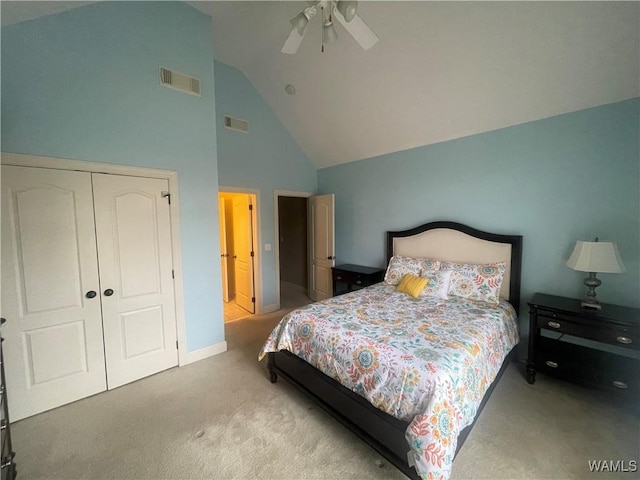 bedroom featuring light carpet, a closet, visible vents, and a ceiling fan