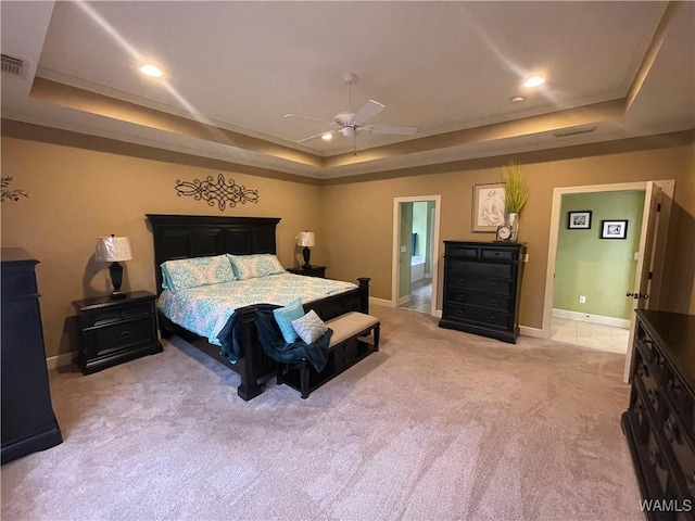 bedroom featuring baseboards and a tray ceiling