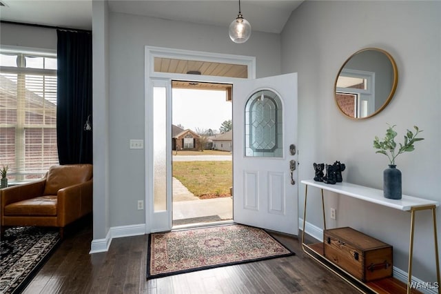 entryway with baseboards and dark wood finished floors