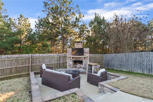 view of patio featuring an outdoor living space with a fireplace