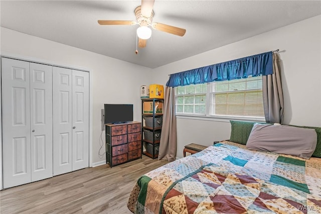 12515 Bone Camp Rd, Northport, AL 35475 - bedroom with wood finished floors, a closet, ceiling fan, and baseboards