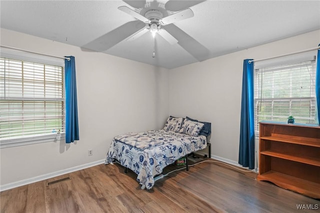 12515 Bone Camp Rd, Northport, AL 35475 - bedroom with wood finished floors, baseboards, and a ceiling fan