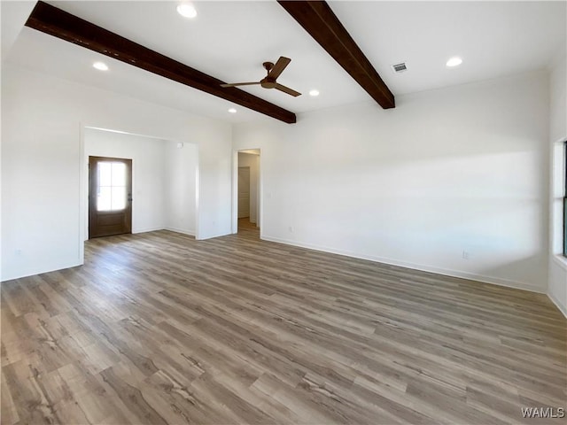 unfurnished room with baseboards, wood finished floors, recessed lighting, a ceiling fan, and beam ceiling