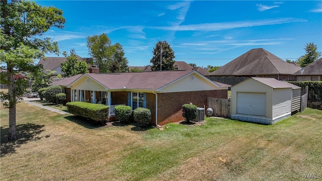 3541 Oak Bend Rd, Tuscaloosa, AL 35406 - ranch-style home featuring an outbuilding, a detached garage, a chimney, and brick siding