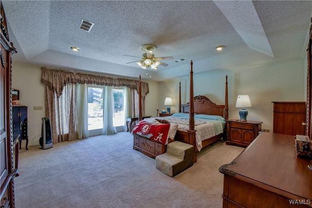 3541 Oak Bend Rd, Tuscaloosa, AL 35406 - bedroom with a raised ceiling, light colored carpet, a textured ceiling, and a ceiling fan