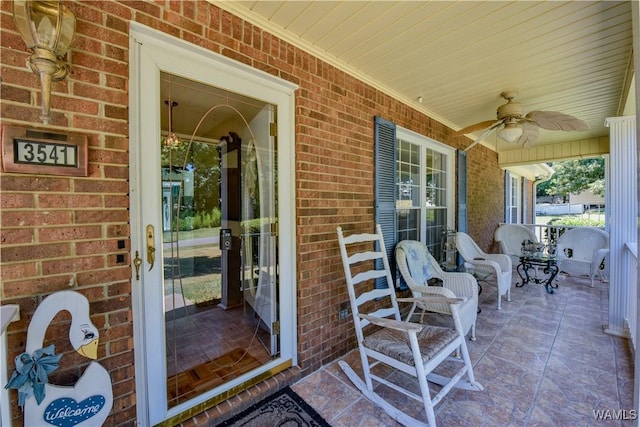 3541 Oak Bend Rd, Tuscaloosa, AL 35406 - view of exterior entry with covered porch, brick siding, and ceiling fan