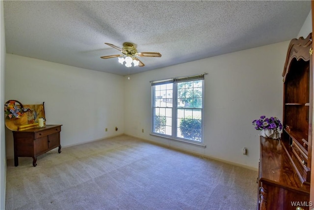 3541 Oak Bend Rd, Tuscaloosa, AL 35406 - unfurnished bedroom featuring carpet floors, a textured ceiling, and ceiling fan