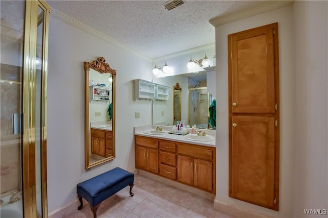 3541 Oak Bend Rd, Tuscaloosa, AL 35406 - full bathroom featuring a textured ceiling, double vanity, a shower stall, and tile patterned flooring